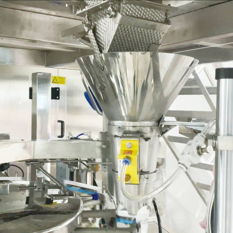 Teknologi penimbang dinamis dan penimbang presisi kombinasi sempurna untuk mesin kemasan makanan beku